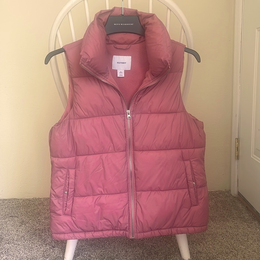 Pink puffer vest.